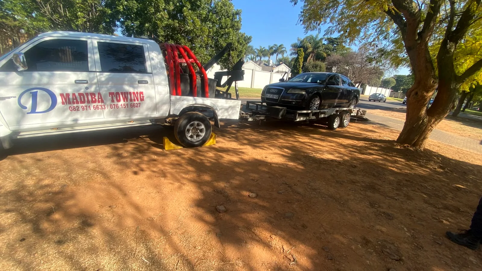 Vehicle being transported safely on a towing trailer
